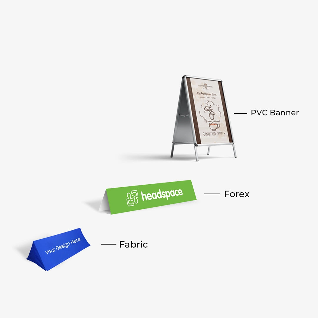 Display of promotional items including a PVC banner, forex stand, and fabric display with customizable designs.
