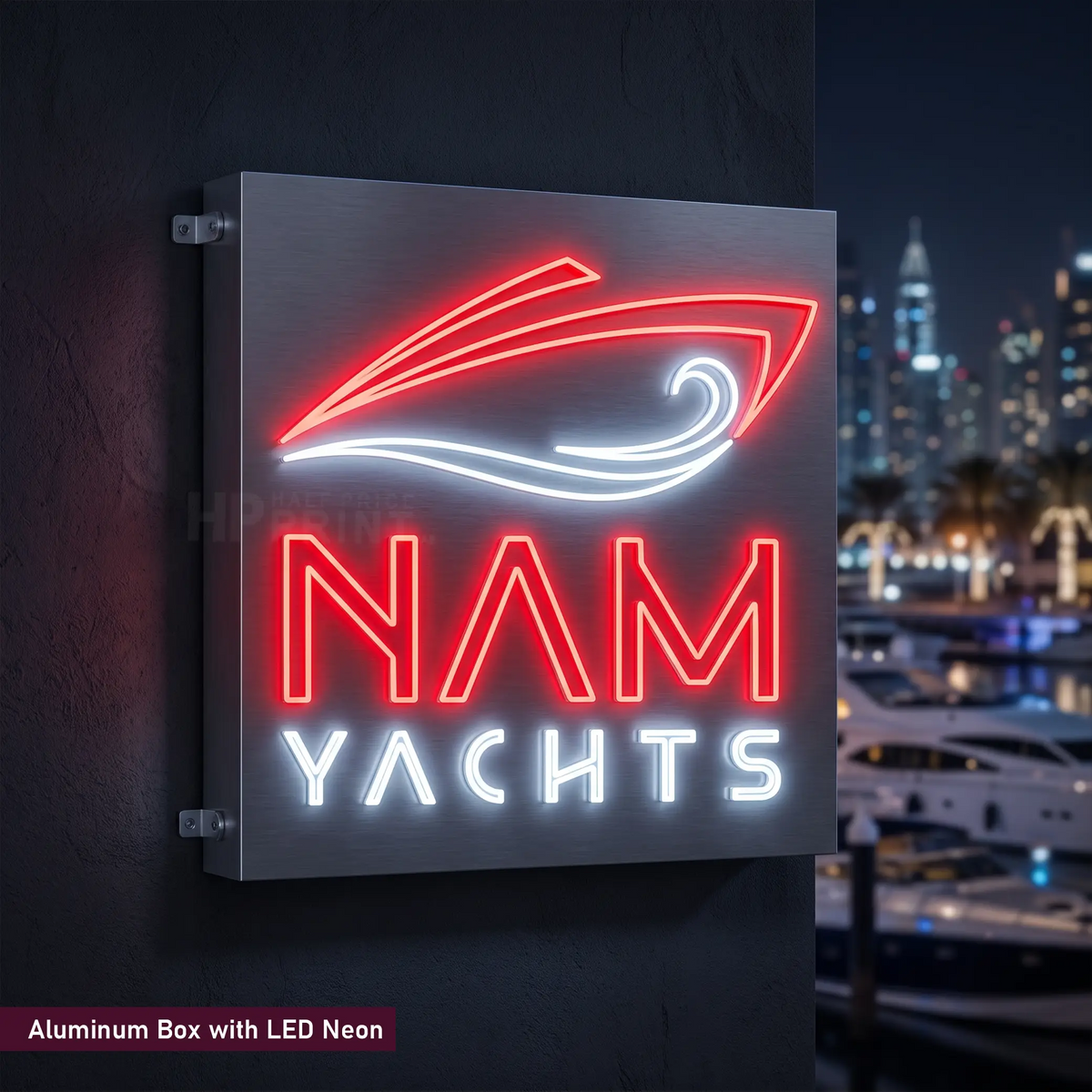 A square LED neon sign for 'NAM YACHTS' mounted on a dark wall, with a blurred marina and city skyline at night in the background. The sign features a red neon sailboat outline and red 'NAM' text, with white 'YACHTS' text below.
