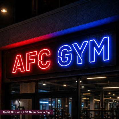A large LED neon sign reading 'AFC GYM' mounted on a dark building facade at night. The letters are split into red on the left and blue on the right, with a dark metal box housing the neon lights.
