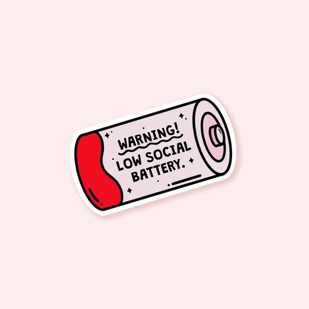 Cartoon-style battery sticker with red low-power section and the text “Warning! Low social battery” on a light pink background.