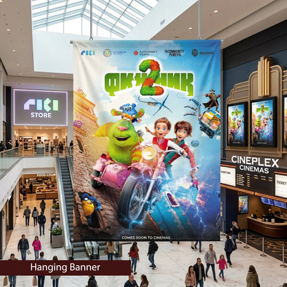 Large movie poster for 'Shrek 2' hanging in a shopping mall with Cineplex Cinemas in the background.