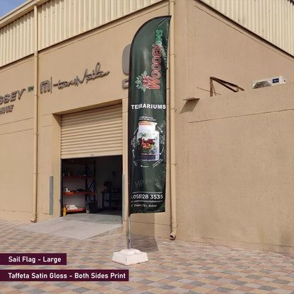 Tall flag banner with branding on a building exterior