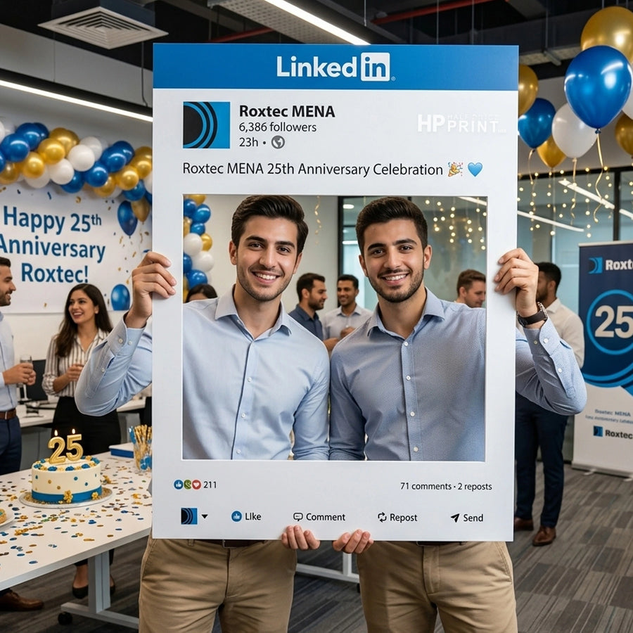 Two men holding a large LinkedIn frame at a Roxtec MENA 25th Anniversary celebration.