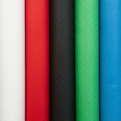 Five rolls of textured fabric in white, red, black, green, and blue.