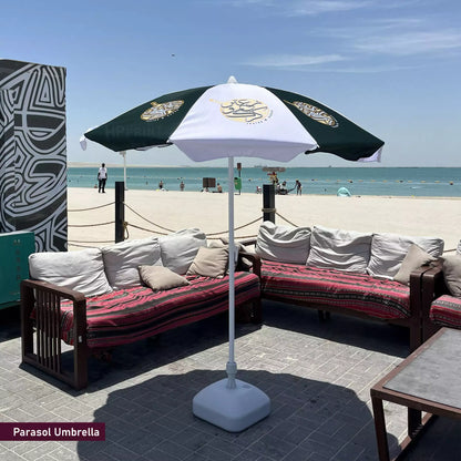 Parasol umbrella with a logo on a patio area by the beach