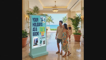 Digital totem display in a resort lobby showing a holiday booking advertisement with a couple walking past.