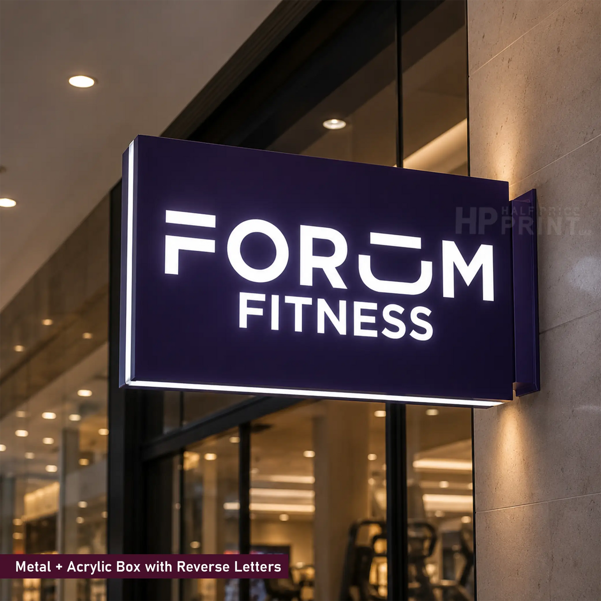 A rectangular illuminated fitness sign mounted on a wall outside a gym. The sign is dark purple with bright white LED lettering that reads 'FORUM FITNESS' and has reverse letters on the side panel.