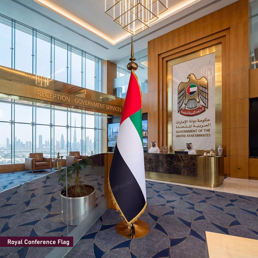 Royal Conference Flag of United Arab Emirates in a modern office setting with reception desk and city view.