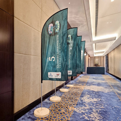 Decorative banners with branding in a hallway with a blue carpet