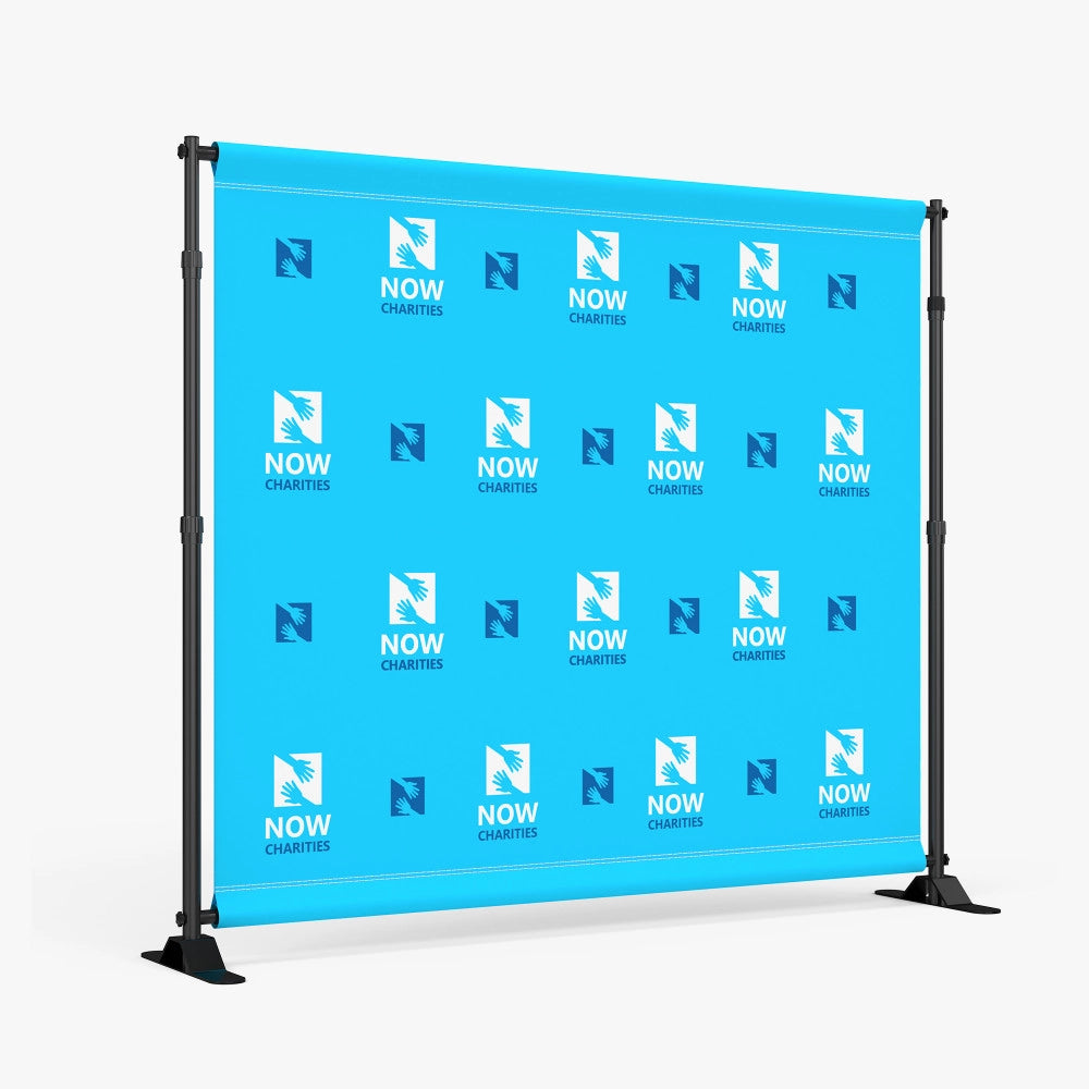 Blue step and repeat backdrop banner featuring a repeating charity logo pattern, mounted on a sturdy freestanding frame for red carpet and event photography.