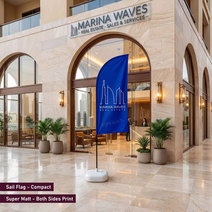 Marina Waves real estate office with a blue flag displaying the brand logo.